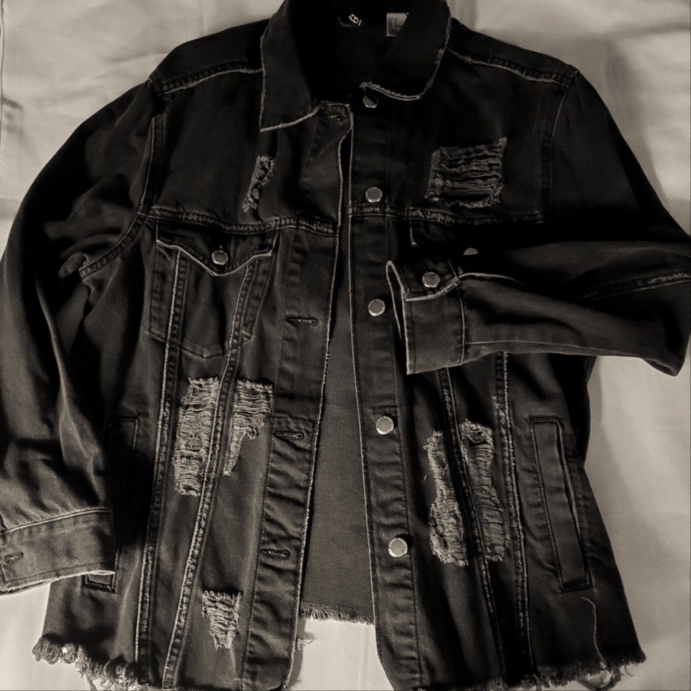Distressed faded denim jacket